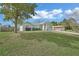 Beautiful home showcases a vast front lawn leading to a charming facade and an attached two-car garage at 2937 Garret St, Deltona, FL 32738