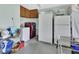 Laundry room and additional refrigerator provides ample space for storage and organization at 2937 Garret St, Deltona, FL 32738
