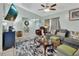 Cozy living room boasting neutral tones, tiled floors, comfortable seating, and natural light at 2937 Garret St, Deltona, FL 32738