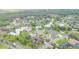 Aerial view of a neighborhood featuring beautiful homes, ponds and lush trees at 3 Whipper In Cir, Ormond Beach, FL 32174