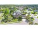 Beautiful aerial view of a well-maintained home in a lush, green community with a nearby lake at 3 Whipper In Cir, Ormond Beach, FL 32174