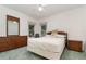 Comfortable bedroom furnished with a bed, dresser, and nightstand. Windows offer natural light at 3 Whipper In Cir, Ormond Beach, FL 32174