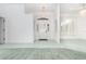 Welcoming foyer with tile floors, a chandelier, and a decorative front door that brings natural light into the home at 3 Whipper In Cir, Ormond Beach, FL 32174