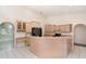 Modern kitchen with a breakfast bar, updated appliances, and ample counter space at 3 Whipper In Cir, Ormond Beach, FL 32174