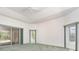 Bright main bedroom featuring high ceilings, recessed lighting, and sliding door access to the lanai at 3 Whipper In Cir, Ormond Beach, FL 32174