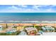 Coastal property near the ocean, featuring colorful townhomes and a refreshing community pool at 3000 Ocean Shore Blvd # 6, Ormond Beach, FL 32176