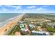 Scenic coastal neighborhood view featuring colorful homes near the beach and a racetrack in the distance at 3000 Ocean Shore Blvd # 6, Ormond Beach, FL 32176