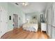 Inviting bedroom with wood floors and natural light from plantation shutters at 3000 Ocean Shore Blvd # 6, Ormond Beach, FL 32176