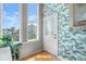 Bright entryway with palm wallpaper and natural light from large windows at 3000 Ocean Shore Blvd # 6, Ormond Beach, FL 32176