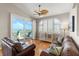 Cozy living room featuring hardwood floors, ocean view sliding doors and comfortable sofas at 3000 Ocean Shore Blvd # 6, Ormond Beach, FL 32176
