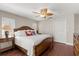 Bedroom features hardwood floors, ceiling fan, closet, and neutral paint at 3000 Ocean Shore Blvd # 6, Ormond Beach, FL 32176
