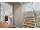 Staircase leads to a bedroom with beautiful wood floors and neutral paint at 3000 Ocean Shore Blvd # 6, Ormond Beach, FL 32176
