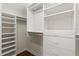 Walk-in closet features custom shelving and drawer storage solutions at 3000 Ocean Shore Blvd # 6, Ormond Beach, FL 32176