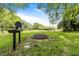 Outdoor fire pit with a grill, picnic tables, and lovely views of the lake. Great for entertaining at 313 Dirksen Dr # G4, Debary, FL 32713