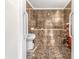 Bathroom featuring tiled walls, a tub, shower, and vintage vanity at 313 Dirksen Dr # G4, Debary, FL 32713