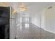 Bright living room featuring tiled floors, ceiling fan, and abundant natural light at 313 Dirksen Dr # G4, Debary, FL 32713