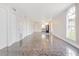 Bright living room with tiled floors featuring large windows and lots of space at 313 Dirksen Dr # G4, Debary, FL 32713