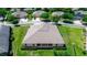 Aerial view of the back of the home featuring a roof with multiple dormer windows and a lush green lawn at 319 E Victoria Trails Blvd, Deland, FL 32724