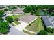 Aerial view of a home showing a wide driveway, attached two-car garage, and proximity to pond at 319 E Victoria Trails Blvd, Deland, FL 32724