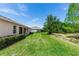 Large backyard with well-manicured lawn and a pond at 319 E Victoria Trails Blvd, Deland, FL 32724