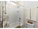 Bright bathroom featuring white tiled shower and modern fixtures at 319 E Victoria Trails Blvd, Deland, FL 32724