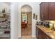 Archway view of dining room, displaying seating and natural light at 319 E Victoria Trails Blvd, Deland, FL 32724