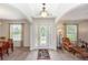 Bright foyer with decorative glass door leading to formal living spaces at 319 E Victoria Trails Blvd, Deland, FL 32724