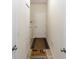 Hallway with tile flooring, utility closet with washer and dryer and neutral paint at 319 E Victoria Trails Blvd, Deland, FL 32724