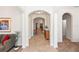 Hallway featuring elegant archways and tile flooring at 319 E Victoria Trails Blvd, Deland, FL 32724