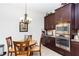 Eat-in kitchen features stainless steel appliances and wooden cabinetry at 319 E Victoria Trails Blvd, Deland, FL 32724