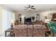Open concept living room with neutral paint, ceiling fan, and tile flooring at 319 E Victoria Trails Blvd, Deland, FL 32724