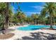 Beautiful community pool featuring crystal-clear water and surrounded by lush landscaping and lounge chairs at 319 E Victoria Trails Blvd, Deland, FL 32724