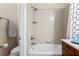 Clean bathroom featuring tub/shower with anchor shower curtain and tile surround at 341 Chelsea Place Ave, Ormond Beach, FL 32174