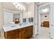 Bathroom with a long vanity, walk-in closet, tile floors, and neutral paint at 341 Chelsea Place Ave, Ormond Beach, FL 32174