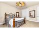Bedroom with tile floors, a ceiling fan, double closet and neutral walls at 341 Chelsea Place Ave, Ormond Beach, FL 32174