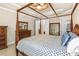 Spacious main bedroom featuring a four-poster bed, ceiling fan, dresser, and neutral walls at 341 Chelsea Place Ave, Ormond Beach, FL 32174