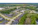 The image shows an aerial view of the neighborhood, a lake, and a street at 341 Chelsea Place Ave, Ormond Beach, FL 32174
