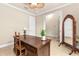 Office space with desk, chair, mirror, and decor at 341 Chelsea Place Ave, Ormond Beach, FL 32174