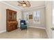 Cozy office space with tile flooring, ceiling fan, shuttered windows and antique wood furniture at 341 Chelsea Place Ave, Ormond Beach, FL 32174