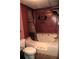 A bathroom with a toilet, vanity, and shower/tub combination at 34416 Oak Ave, Leesburg, FL 34788