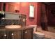 A bathroom with a toilet, vanity, and shower/tub combination at 34416 Oak Ave, Leesburg, FL 34788