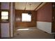 Open dining area with natural light and wall paneling, offering a versatile space at 34416 Oak Ave, Leesburg, FL 34788