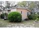 The exterior of this home is surrounded by greenery at 34416 Oak Ave, Leesburg, FL 34788