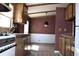 Bright kitchen area with vintage gas range, adjacent to dining room and ample counter space at 34416 Oak Ave, Leesburg, FL 34788