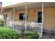 An outdoor porch adds to the appeal of this home at 34416 Oak Ave, Leesburg, FL 34788