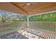Covered balcony with a wood ceiling, open views of the property, and an outdoor rug at 349 Evansdale Rd, Lake Mary, FL 32746