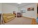 This cozy bedroom is furnished with a comfortable couch, recliner, and plenty of space for relaxation at 349 Evansdale Rd, Lake Mary, FL 32746