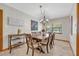 Bright dining room with large wooden table, chairs, and elegant lighting at 349 Evansdale Rd, Lake Mary, FL 32746