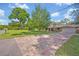 Brick driveway leading up to a traditionally styled home with well-maintained landscaping at 349 Evansdale Rd, Lake Mary, FL 32746