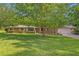 Charming brick home featuring a well-manicured lawn and mature trees at 349 Evansdale Rd, Lake Mary, FL 32746